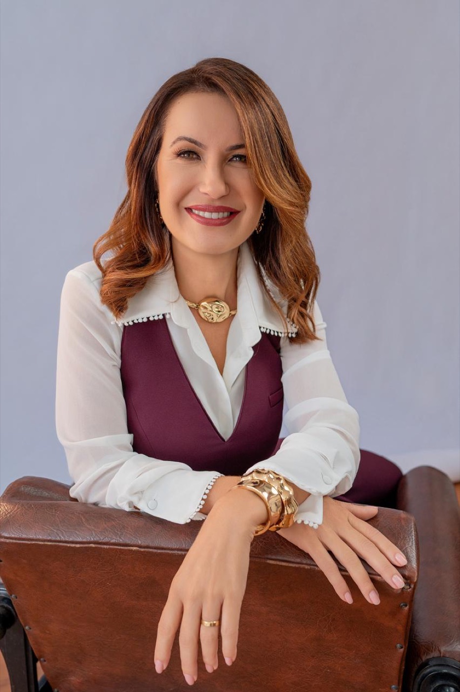 Paty Domingos sorrindo para a câmera